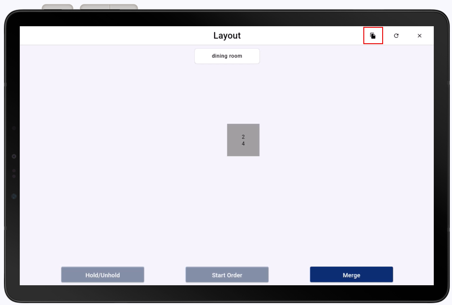 Ticket icon highlighted on table layout screen.