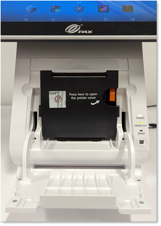 The black internal printer cover with the orange tab clearly visible on the right.