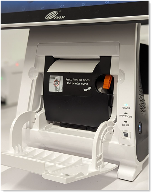 The internal printer door closed with a little excess paper sticking out and the Paper Out light off.